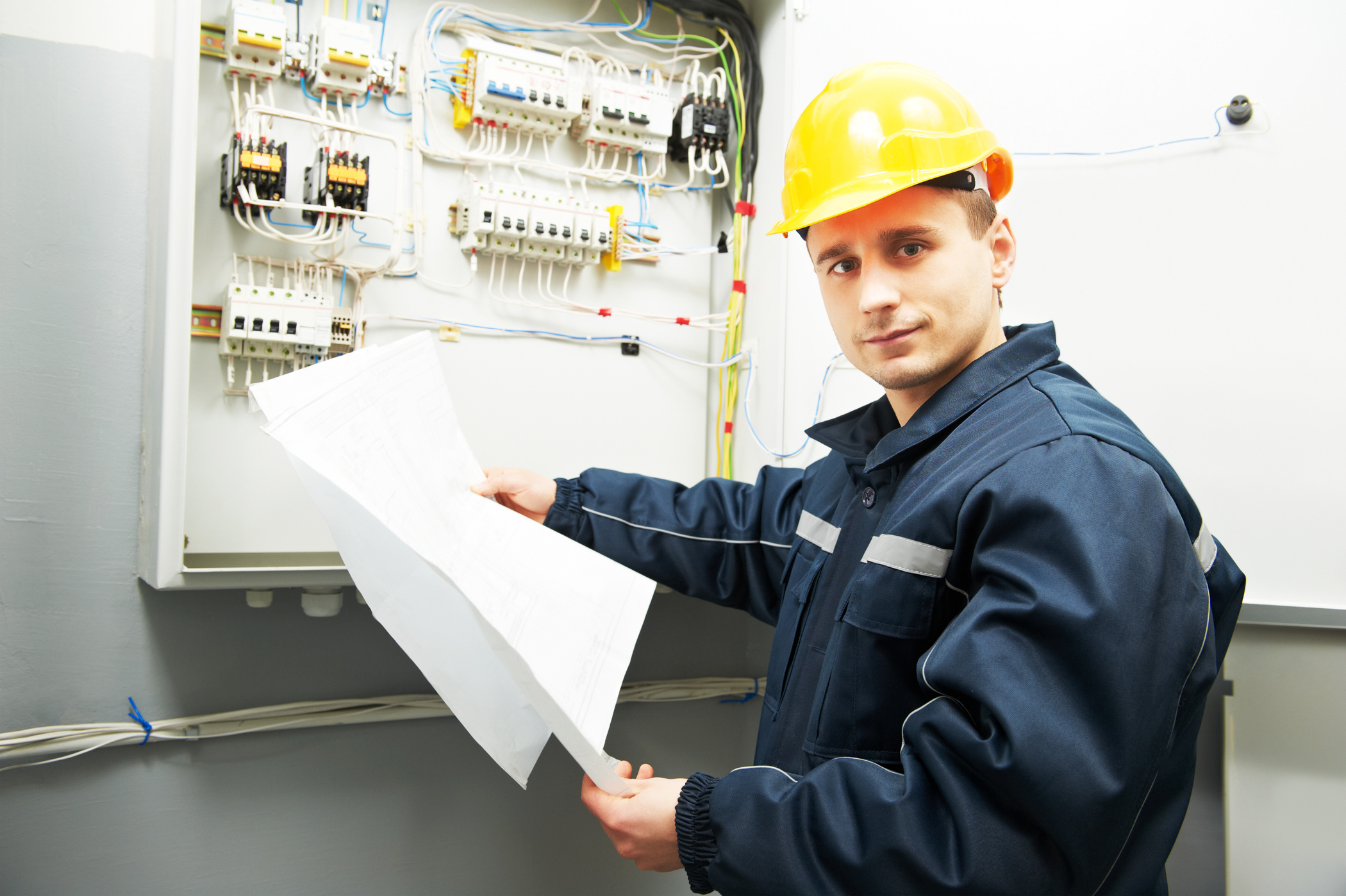Electrician Engineer Worker with Blueprint Project